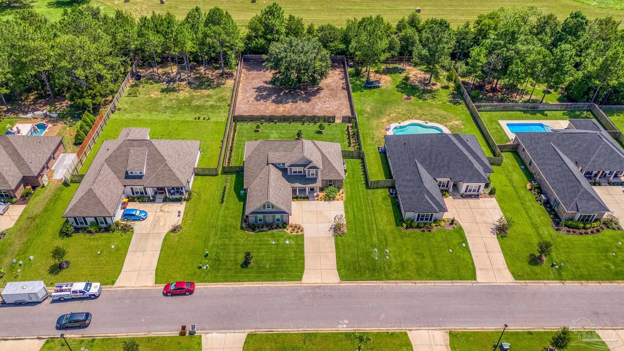 6264 Howie Way Pace, FL 32571 - Photo 39 of 42 an aerial view of residential houses with outdoor space and swimming pool