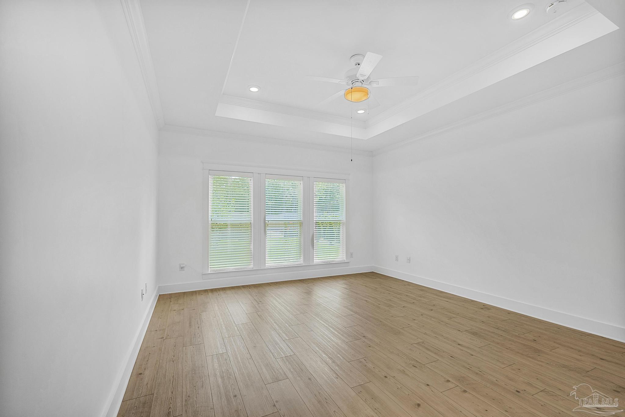 6264 Howie Way Pace, FL 32571 - Photo 5 of 42 a view of room with wooden floor and window