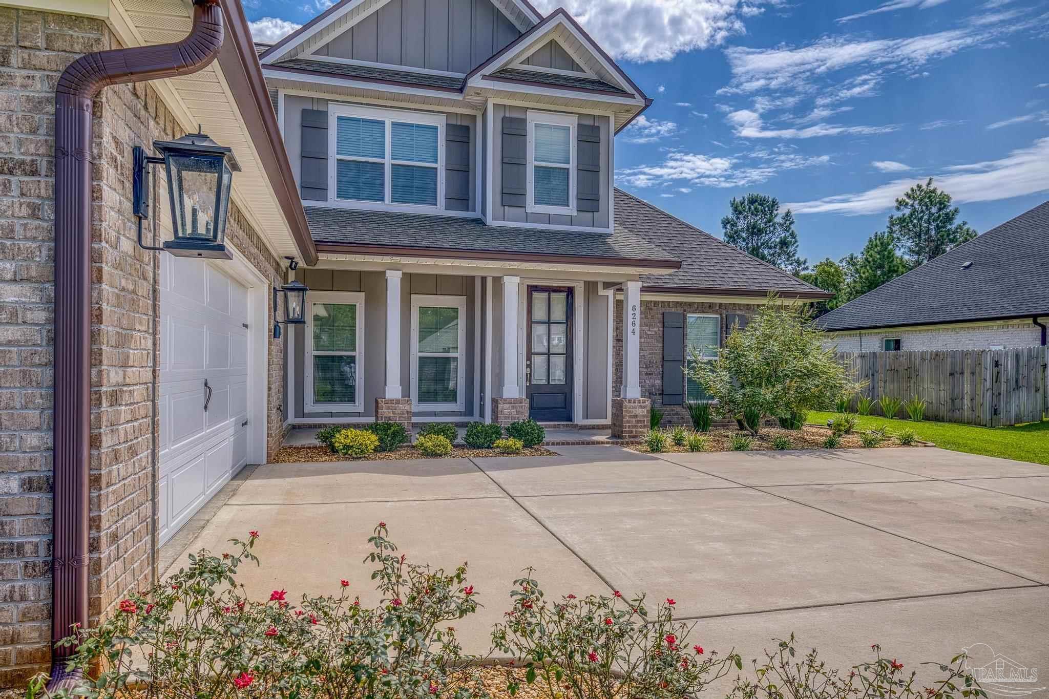 6264 Howie Way Pace, FL 32571 - Photo 7 of 42 front view of a house with a yard