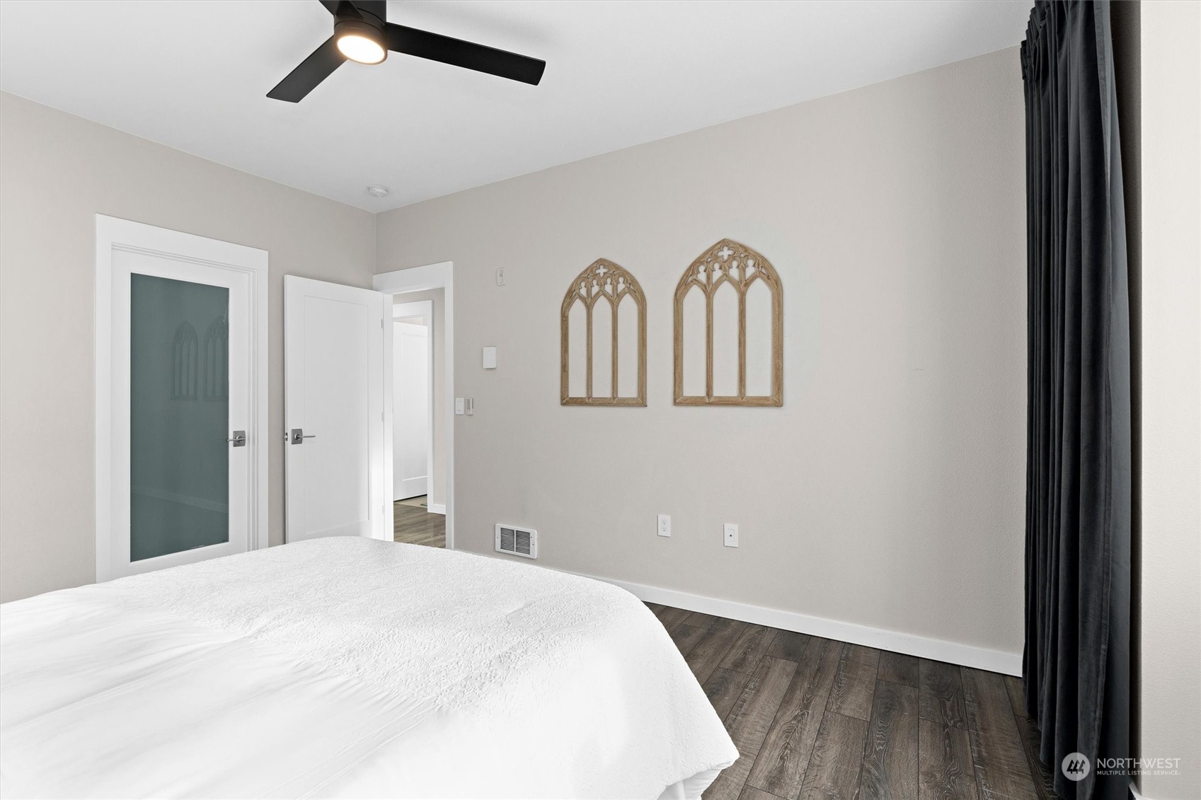 2810 Southeast 8th Street, Unit 2131 Renton, WA 98058 - Photo 18 of 35 a bedroom with a bed and a painting on the wall