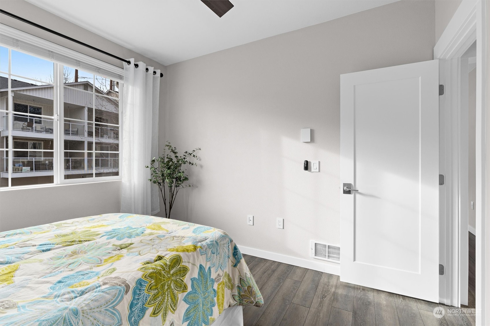 2810 Southeast 8th Street, Unit 2131 Renton, WA 98058 - Photo 22 of 35 a bedroom with a bed and a window