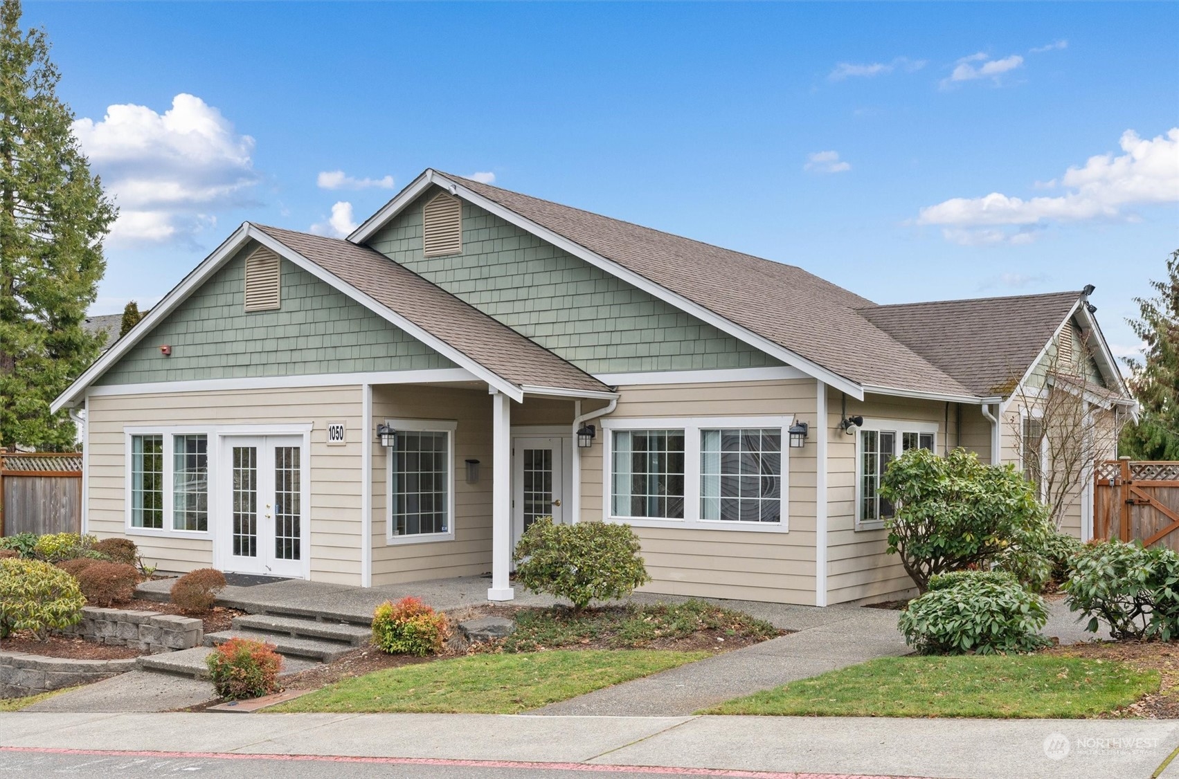 2810 Southeast 8th Street, Unit 2131 Renton, WA 98058 - Photo 29 of 35 a front view of a house with yard and green space