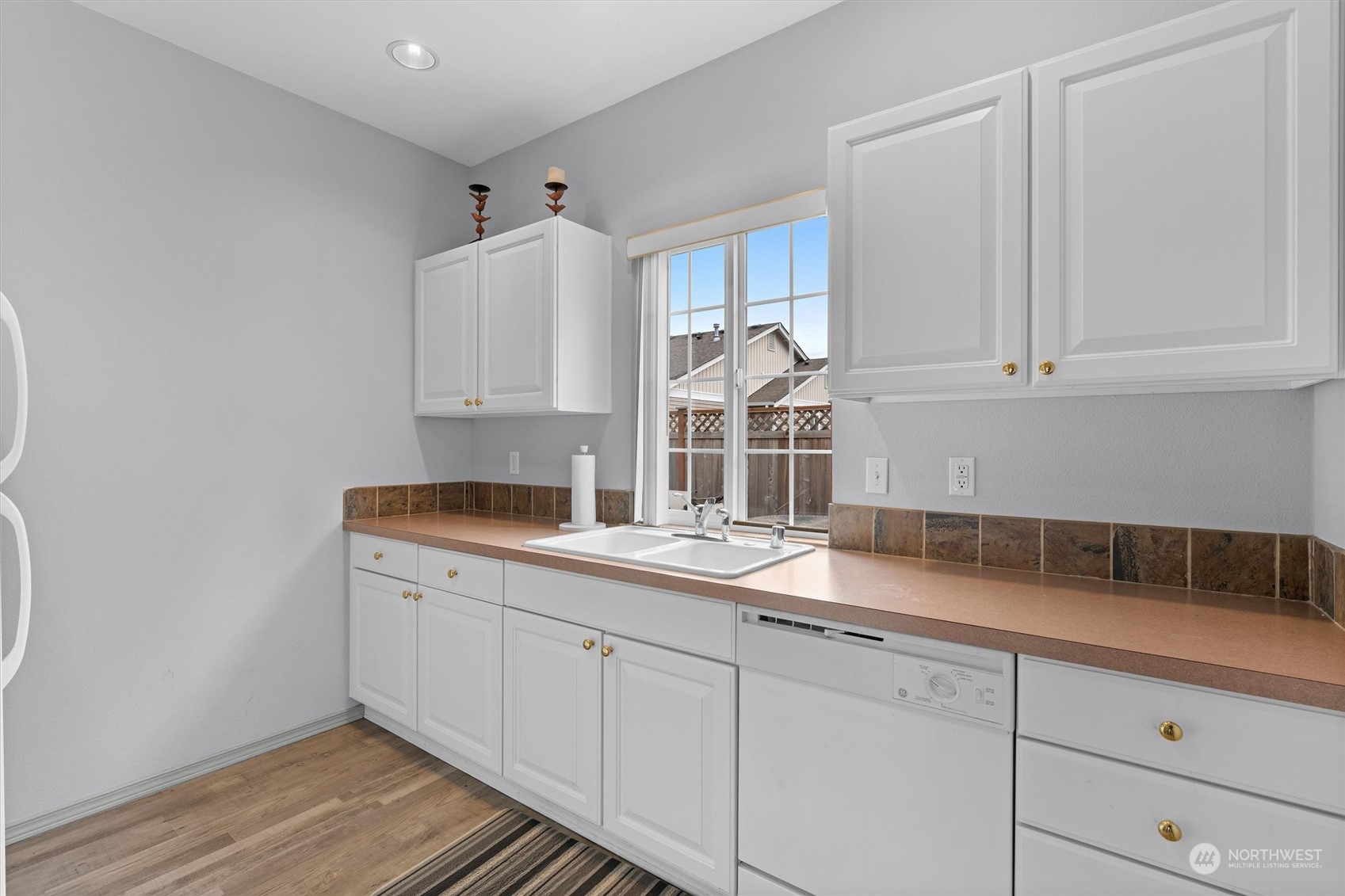 2810 Southeast 8th Street, Unit 2131 Renton, WA 98058 - Photo 32 of 35 a kitchen with a sink and cabinets