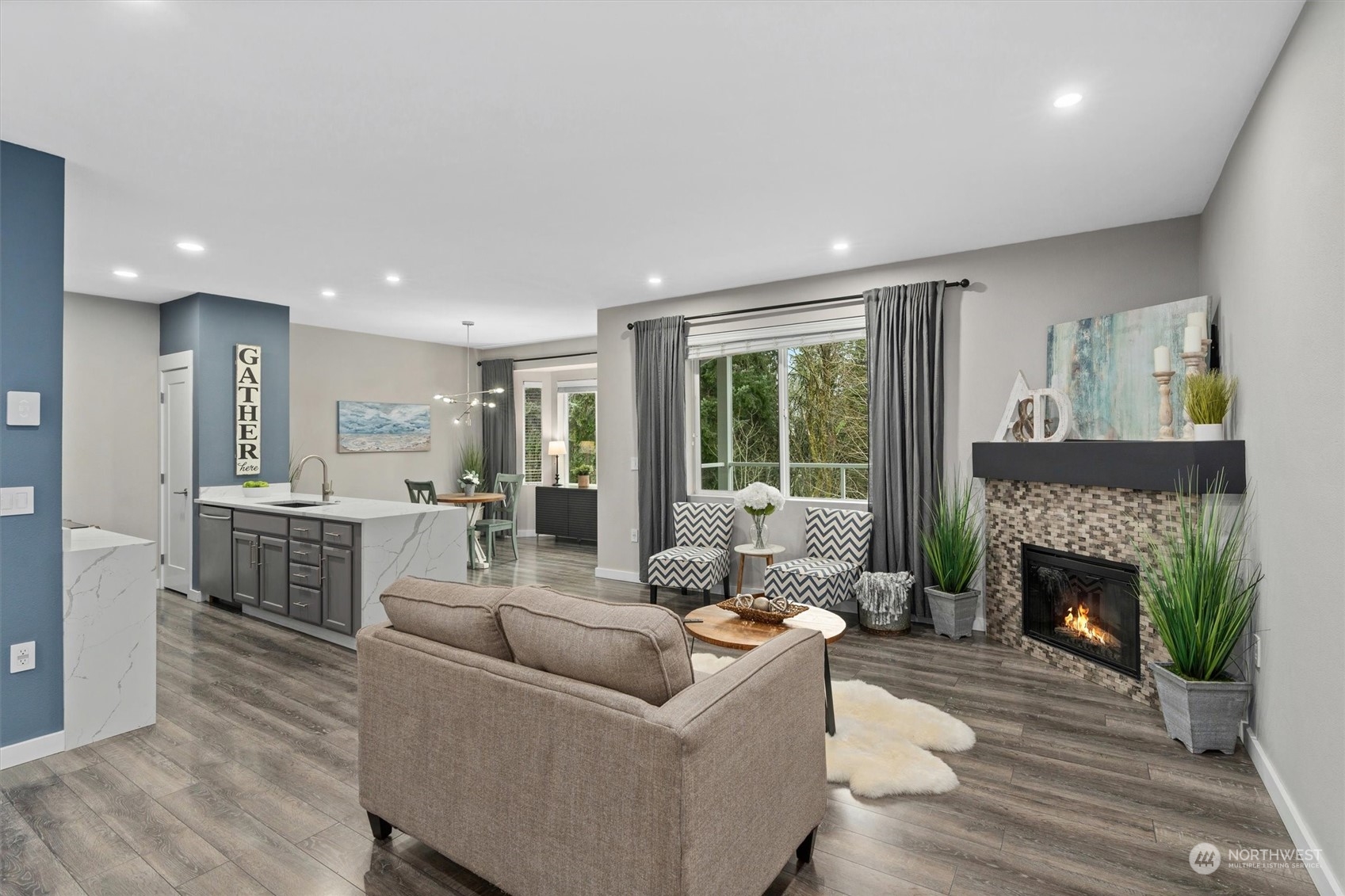 2810 Southeast 8th Street, Unit 2131 Renton, WA 98058 - Photo 7 of 35 a living room with furniture and a fireplace