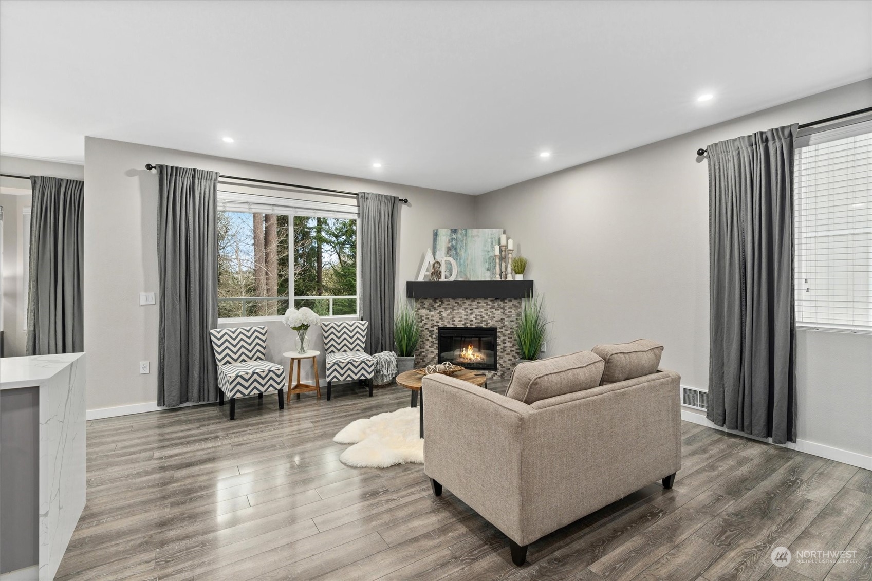 2810 Southeast 8th Street, Unit 2131 Renton, WA 98058 - Photo 8 of 35 a living room with furniture and a fireplace