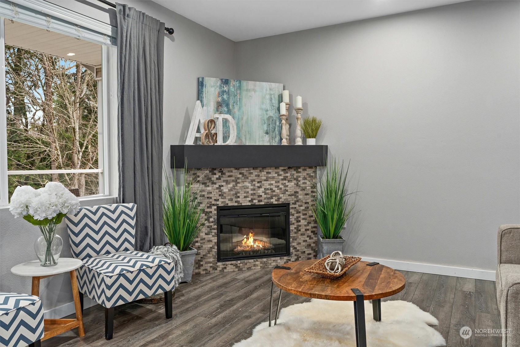 2810 Southeast 8th Street, Unit 2131 Renton, WA 98058 - Photo 10 of 35 a living room with furniture and a fireplace