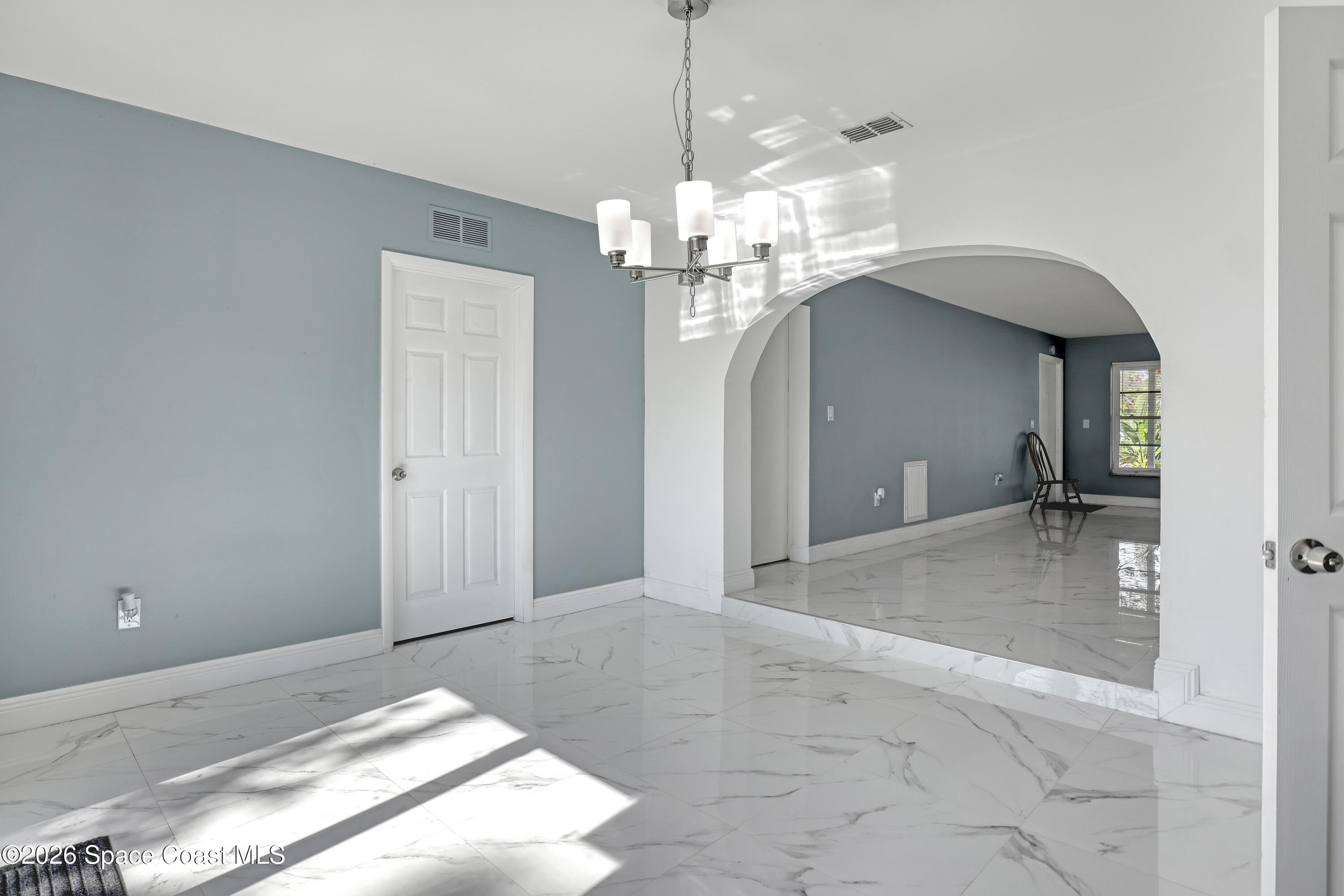 1051 Grove Avenue Cocoa, FL 32922 - Photo 15 of 38 a view of a chandelier in a room