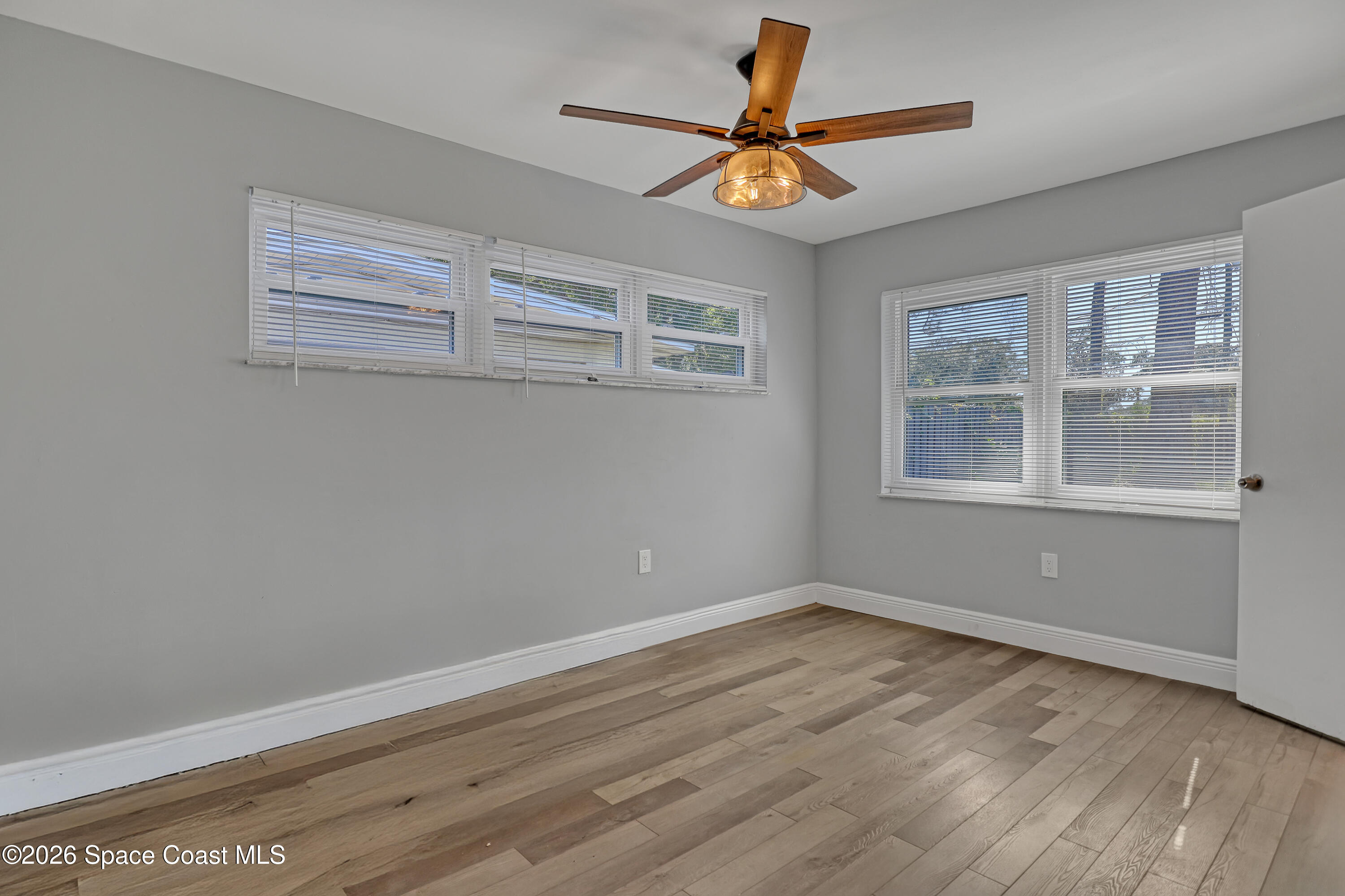 1051 Grove Avenue Cocoa, FL 32922 - Photo 17 of 38 a view of a room with wooden floor and a window