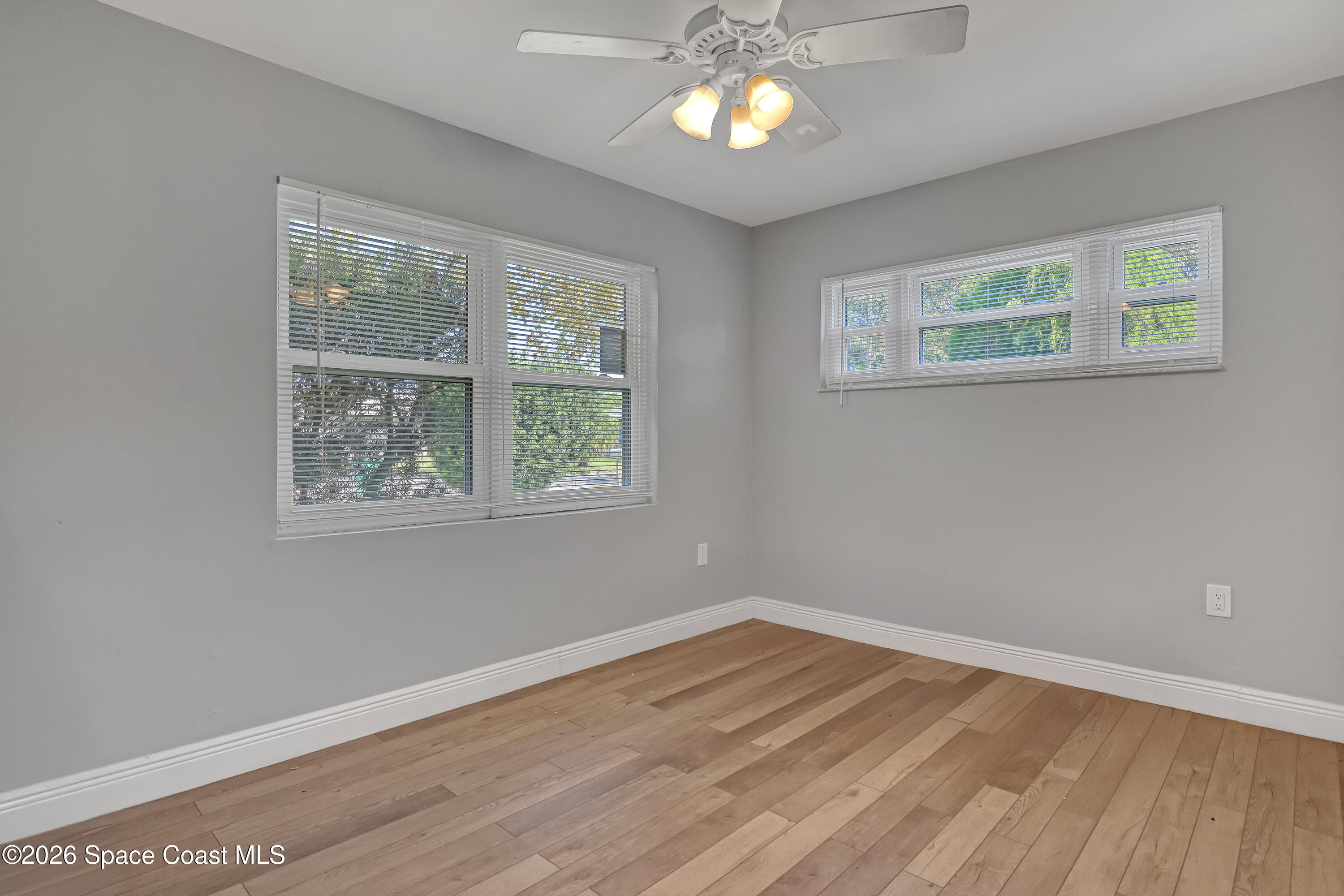1051 Grove Avenue Cocoa, FL 32922 - Photo 20 of 38 a view of empty room with wooden floor and fan