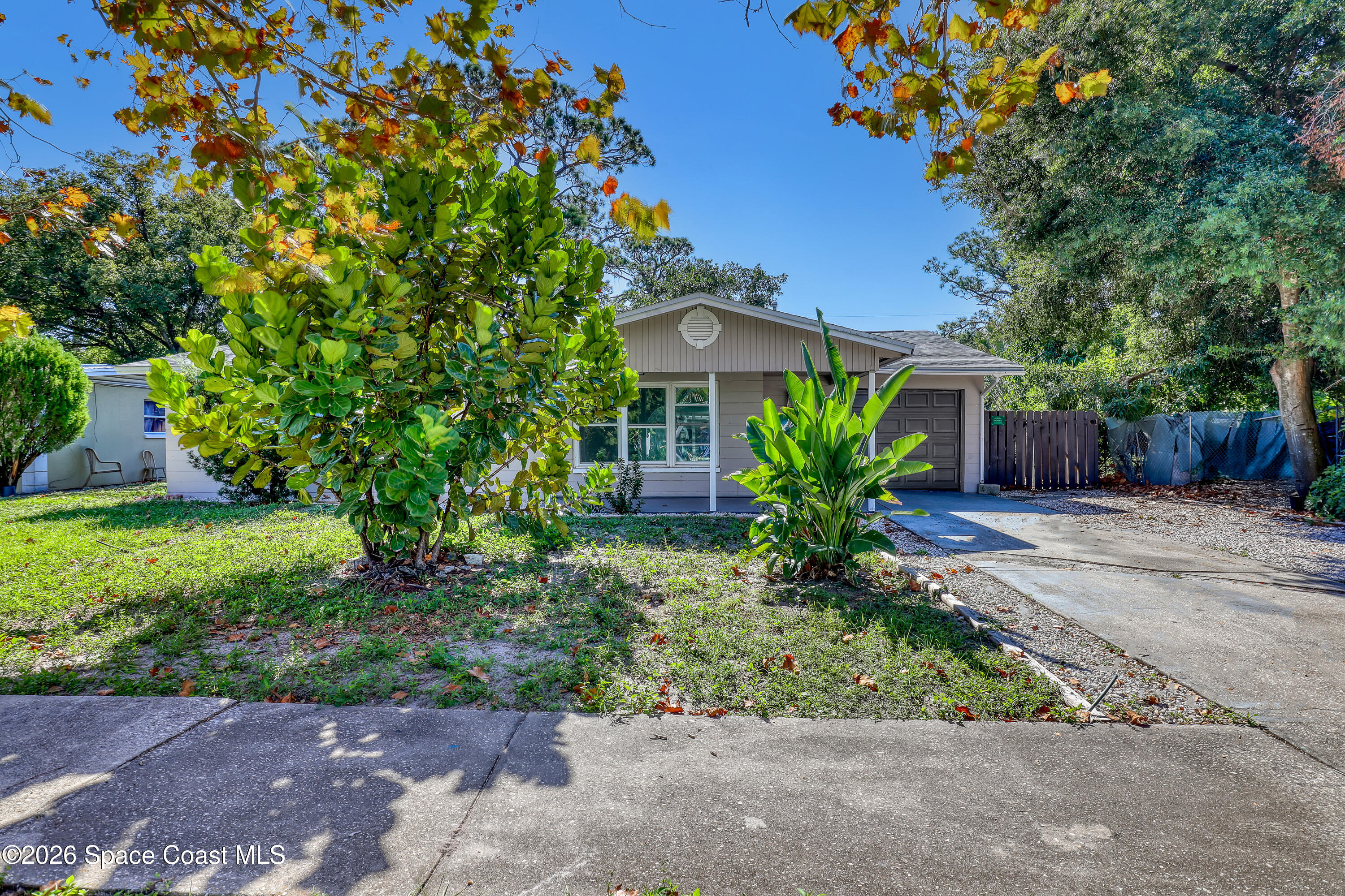 1051 Grove Avenue Cocoa, FL 32922 - Photo 2 of 38 a view of a house with a yard and a garden
