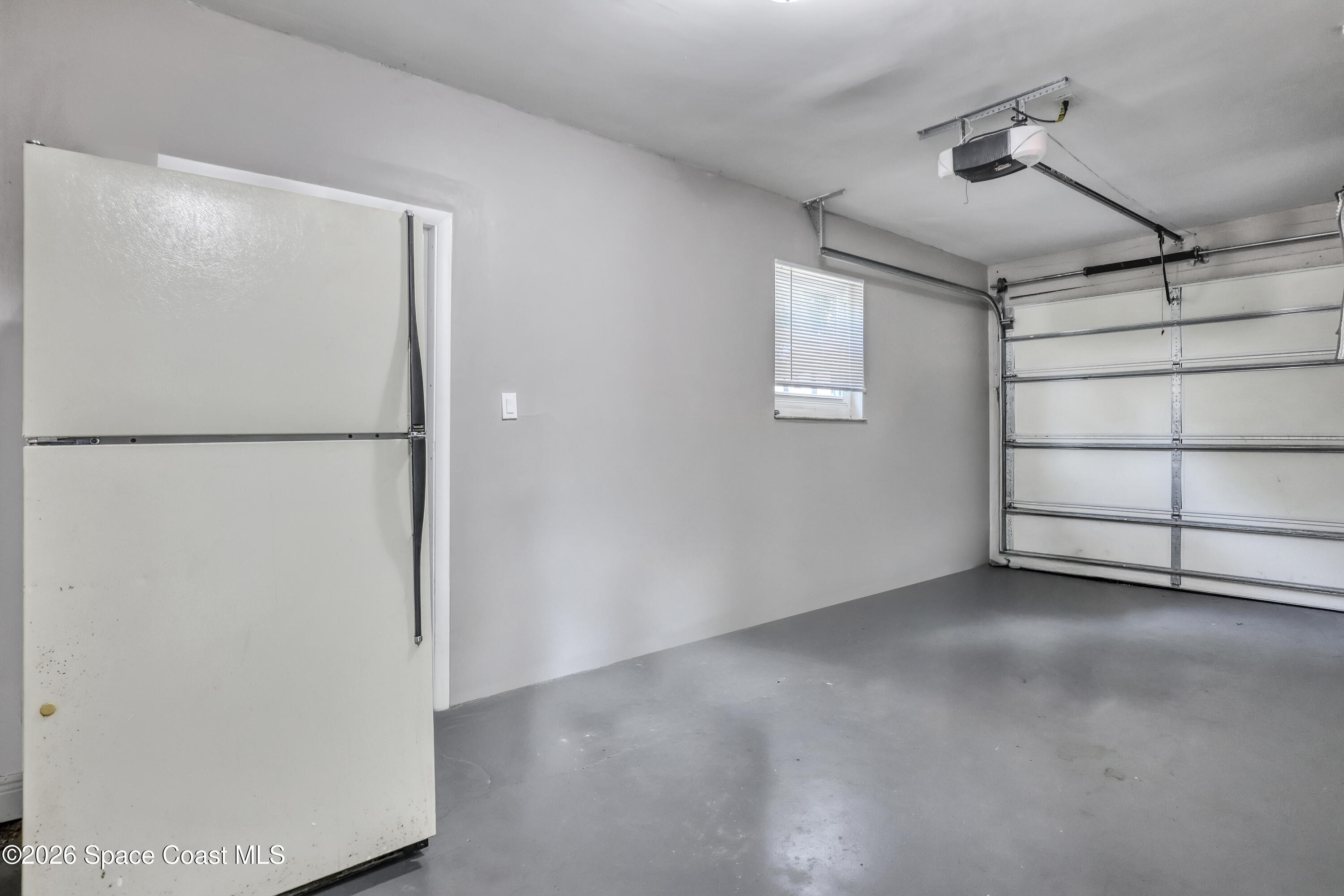 1051 Grove Avenue Cocoa, FL 32922 - Photo 28 of 38 a view of a refrigerator in kitchen and a refrigerator