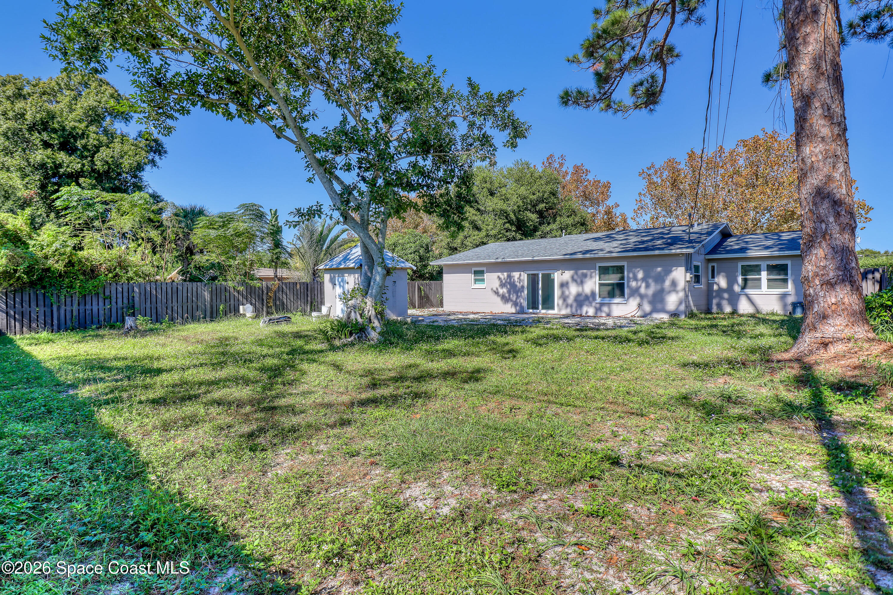 1051 Grove Avenue Cocoa, FL 32922 - Photo 29 of 38 a view of a house with a yard and potted plants