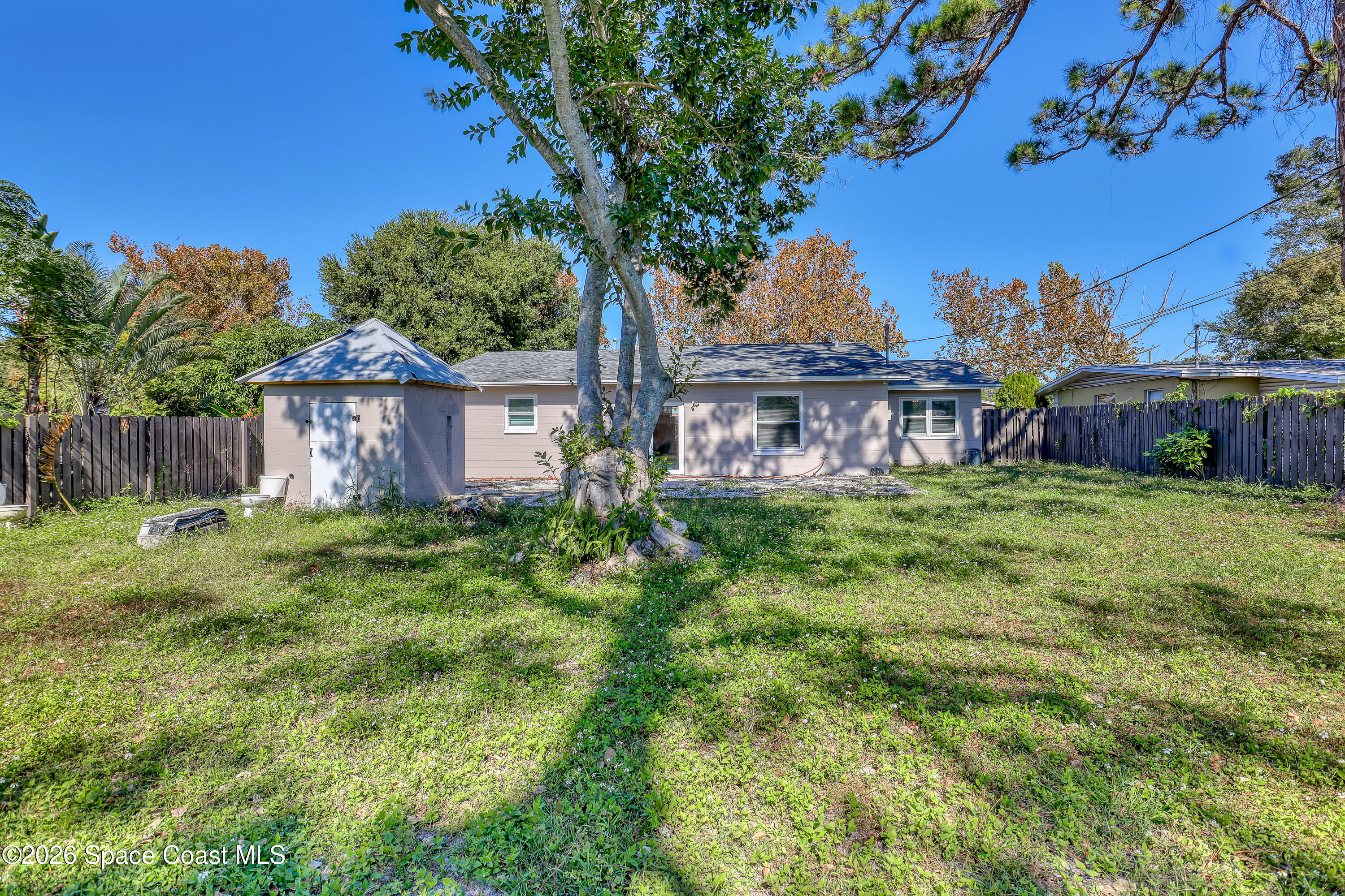 1051 Grove Avenue Cocoa, FL 32922 - Photo 30 of 38 a view of a house with a yard