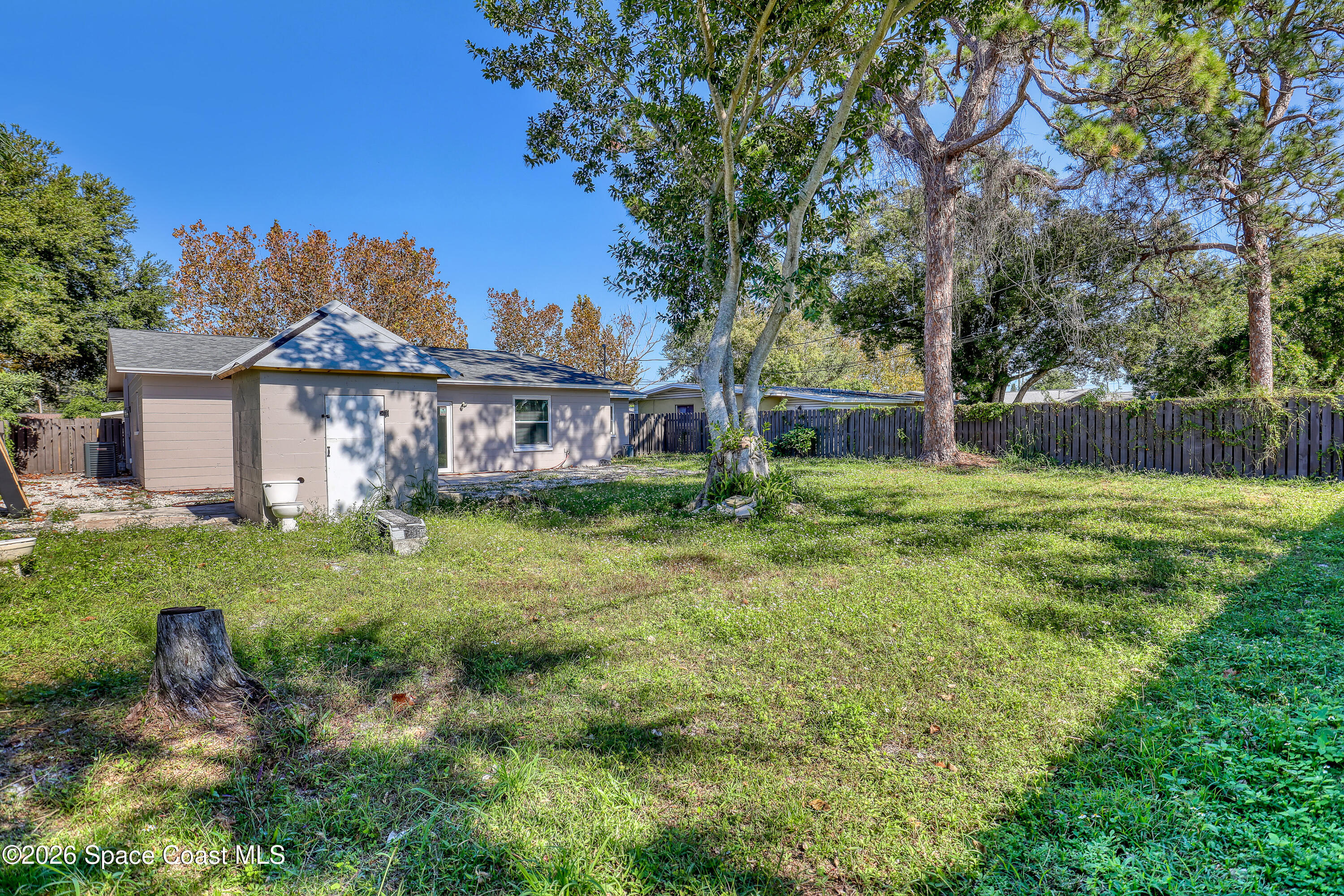 1051 Grove Avenue Cocoa, FL 32922 - Photo 31 of 38 a view of a house with a yard