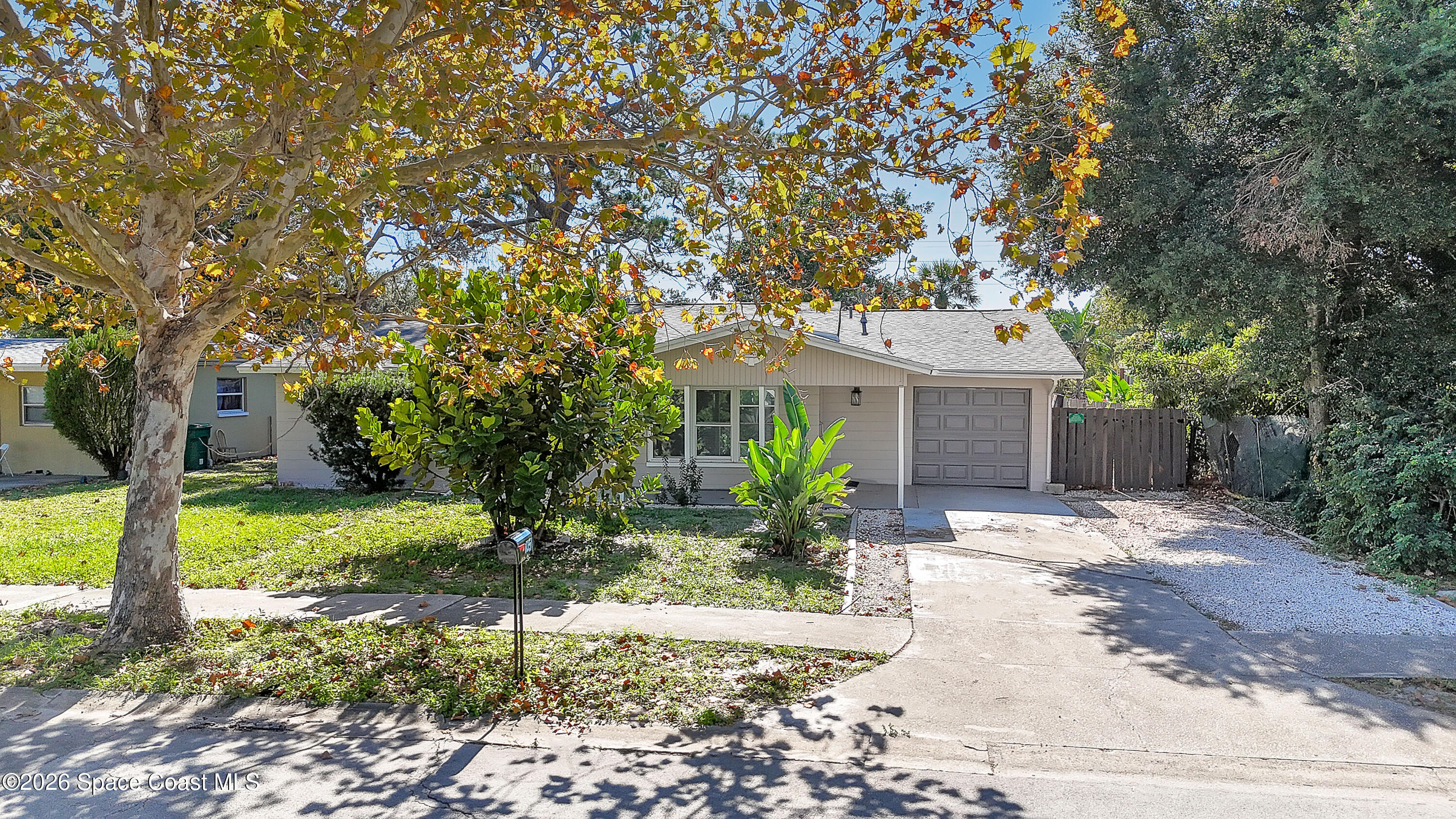 1051 Grove Avenue Cocoa, FL 32922 - Photo 33 of 38 a front view of a house with a garden
