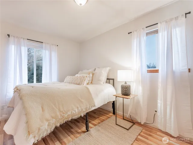 a bedroom with a bed and a couch