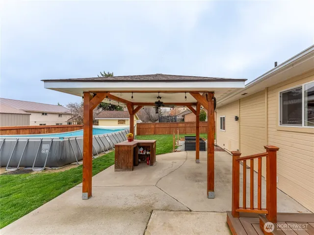 a view of a house with a yard and porch