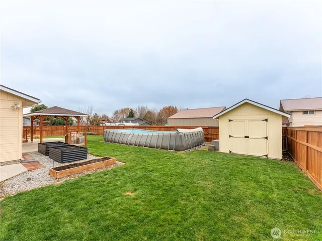 a view of a backyard with wooden floor