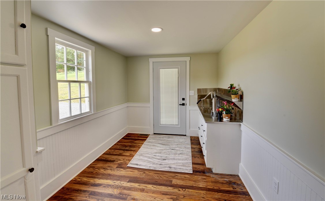9734 Edwards Ridge Road Southeast Uhrichsville, OH 44683 - Photo 4 of 35 Entryway with dark hardwood flooring