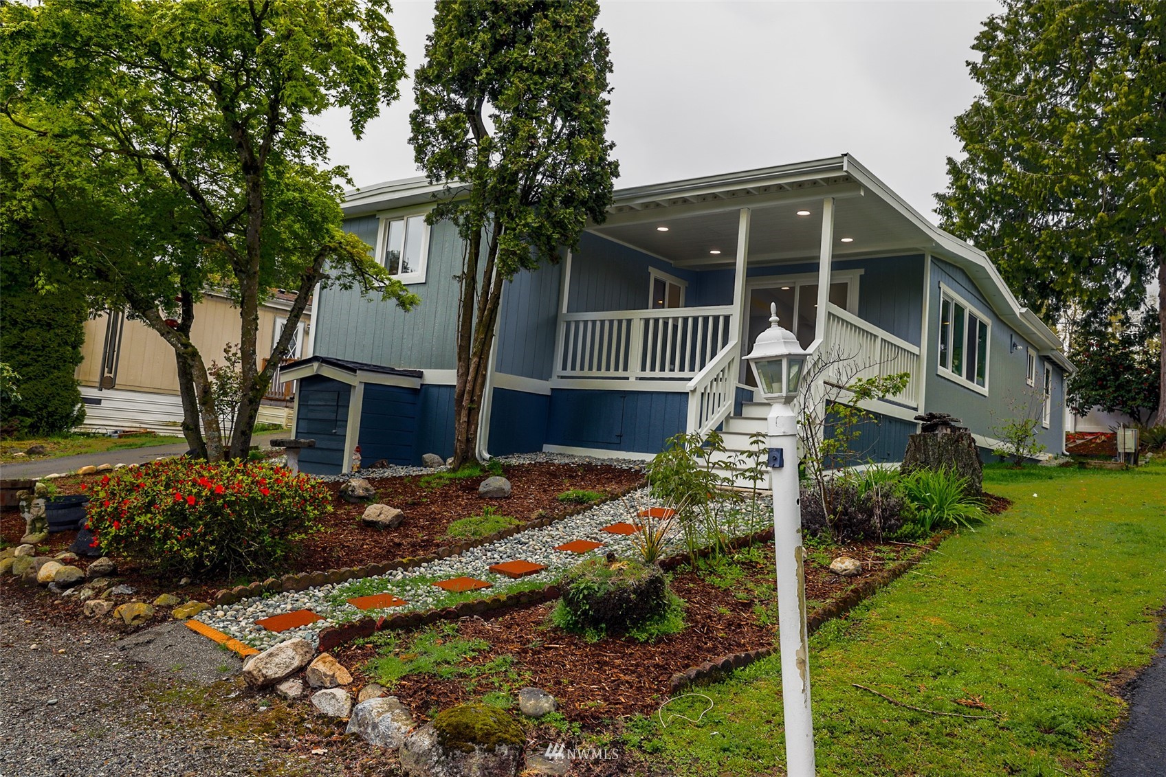 3504 Seattle Hill Road, Unit 2 Mill Creek, WA 98012 - Photo 1 of 30 a front view of a house with garden