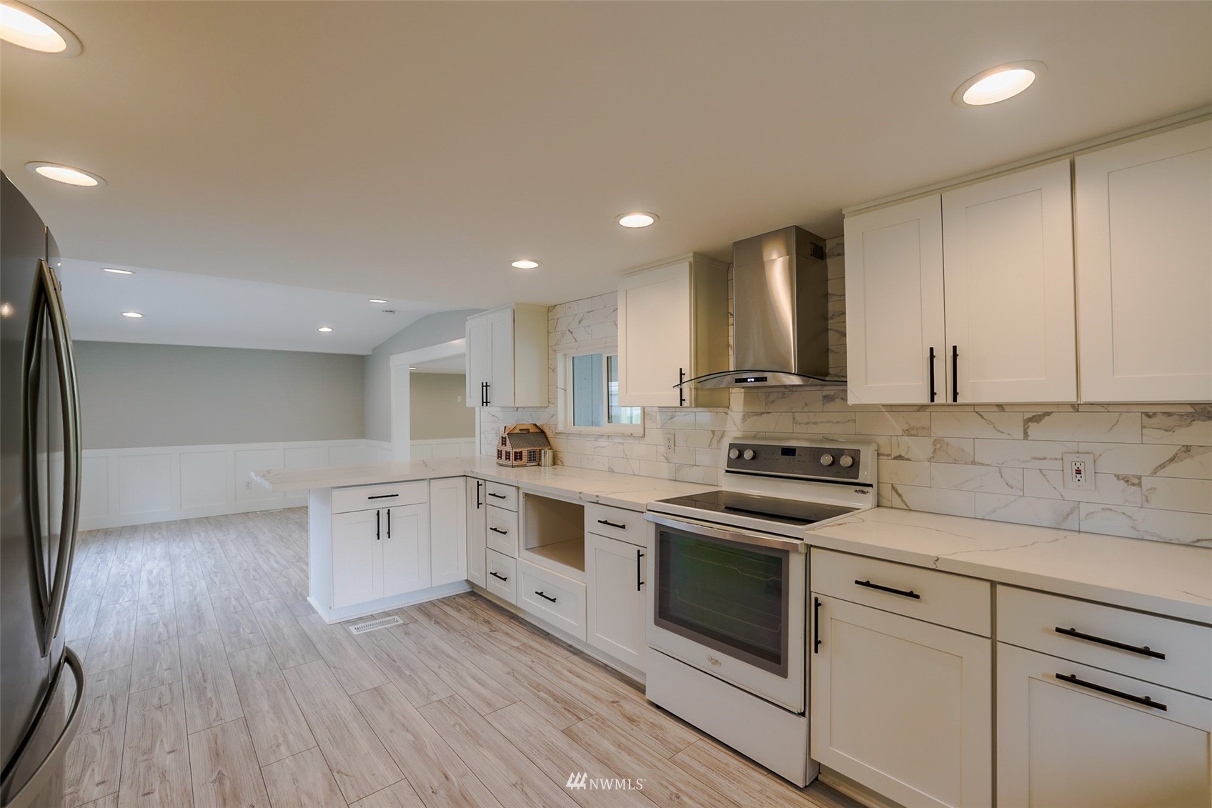 3504 Seattle Hill Road, Unit 2 Mill Creek, WA 98012 - Photo 12 of 30 a kitchen with granite countertop white cabinets and white appliances