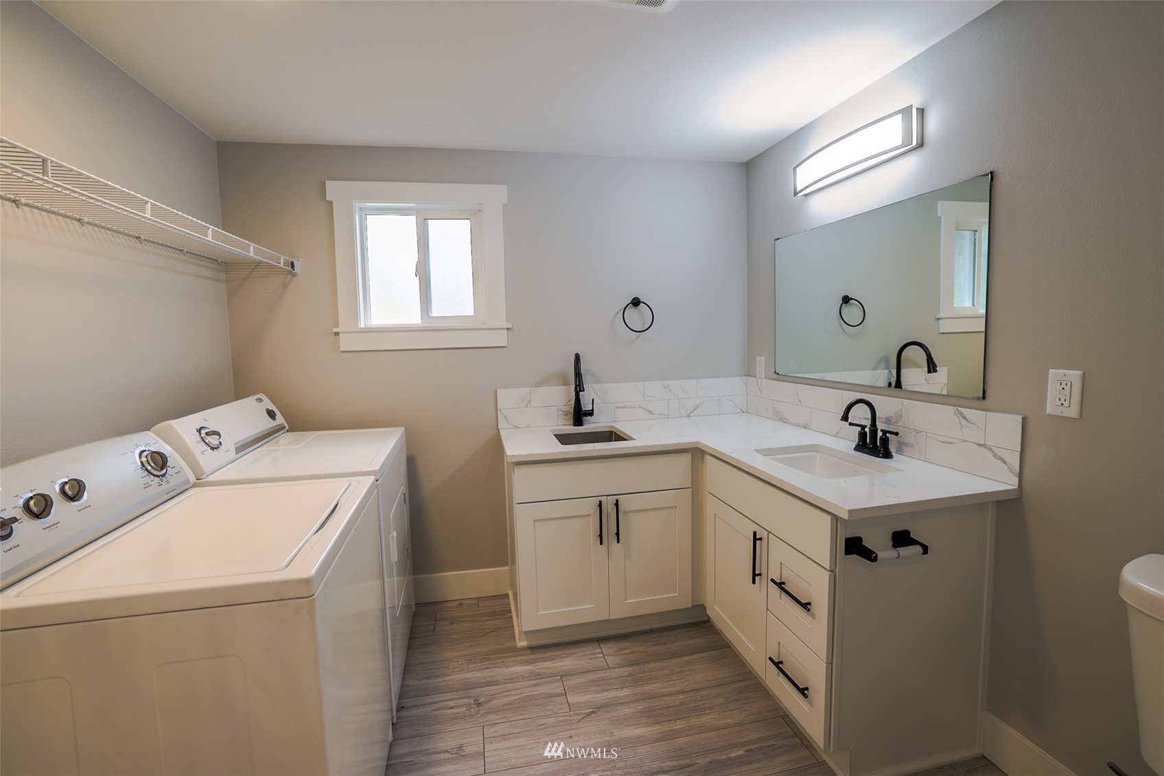 3504 Seattle Hill Road, Unit 2 Mill Creek, WA 98012 - Photo 14 of 30 a bathroom with a sink and a mirror