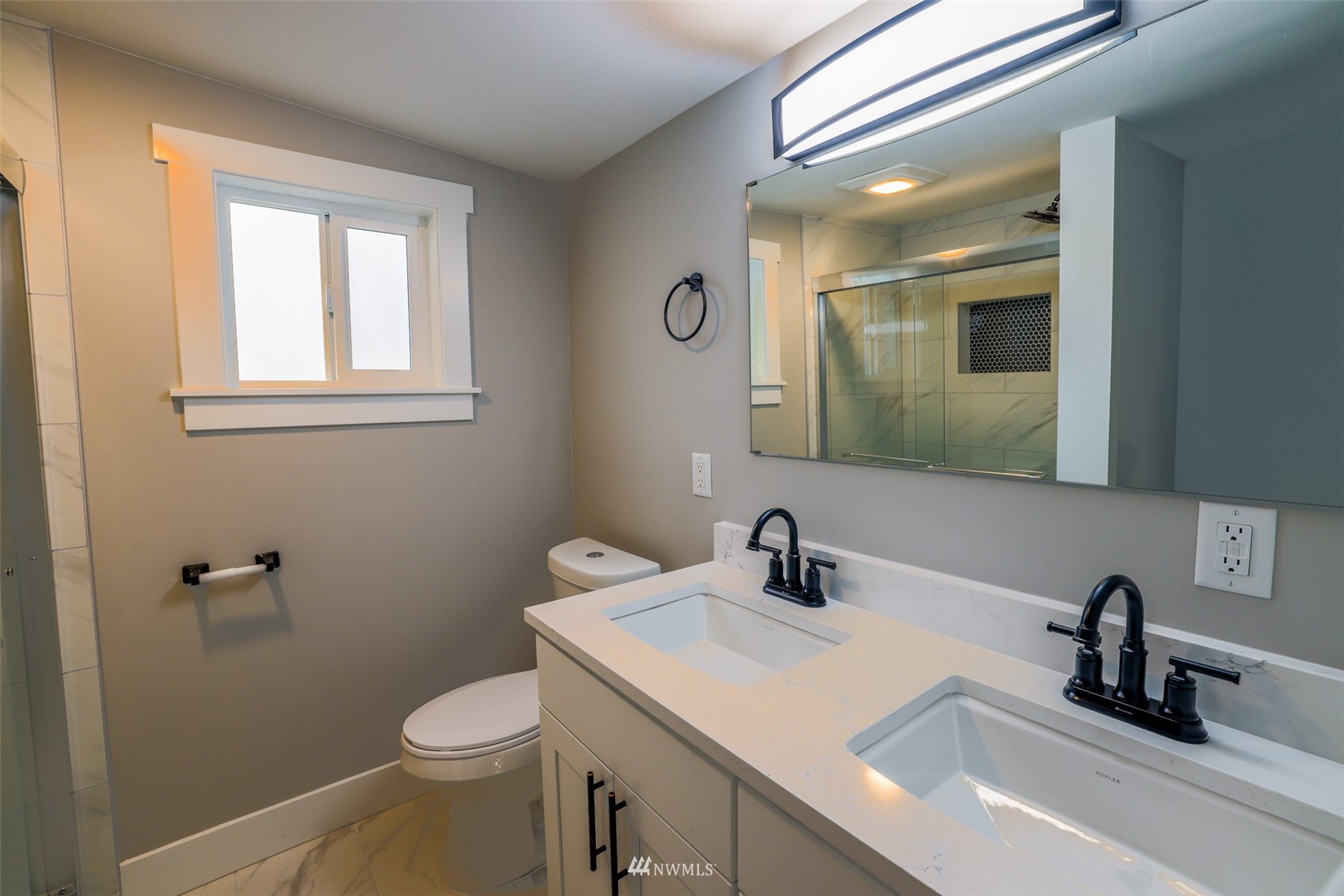 3504 Seattle Hill Road, Unit 2 Mill Creek, WA 98012 - Photo 18 of 30 a bathroom with a sink a toilet and a mirror