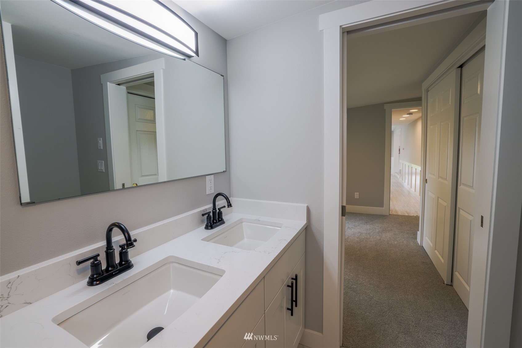 3504 Seattle Hill Road, Unit 2 Mill Creek, WA 98012 - Photo 19 of 30 a bathroom with a sink and a mirror