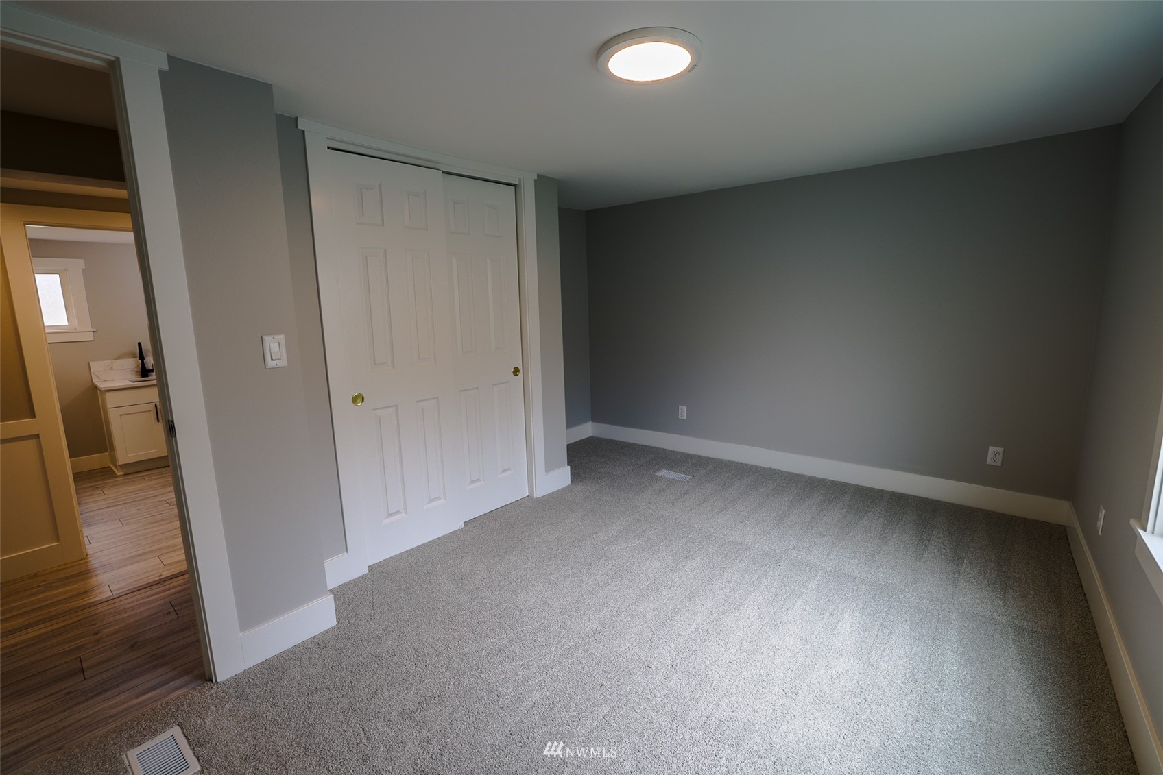 3504 Seattle Hill Road, Unit 2 Mill Creek, WA 98012 - Photo 21 of 30 an empty room and wooden door