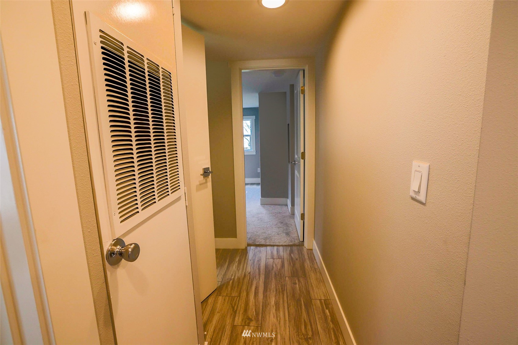 3504 Seattle Hill Road, Unit 2 Mill Creek, WA 98012 - Photo 23 of 30 a view of a hallway with wooden floor and closet