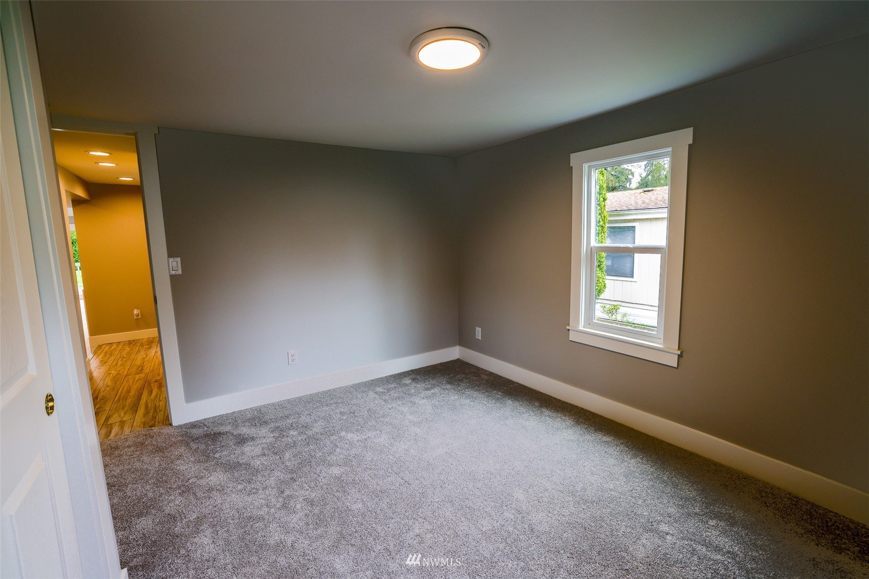 3504 Seattle Hill Road, Unit 2 Mill Creek, WA 98012 - Photo 26 of 30 an empty room with windows and mirror
