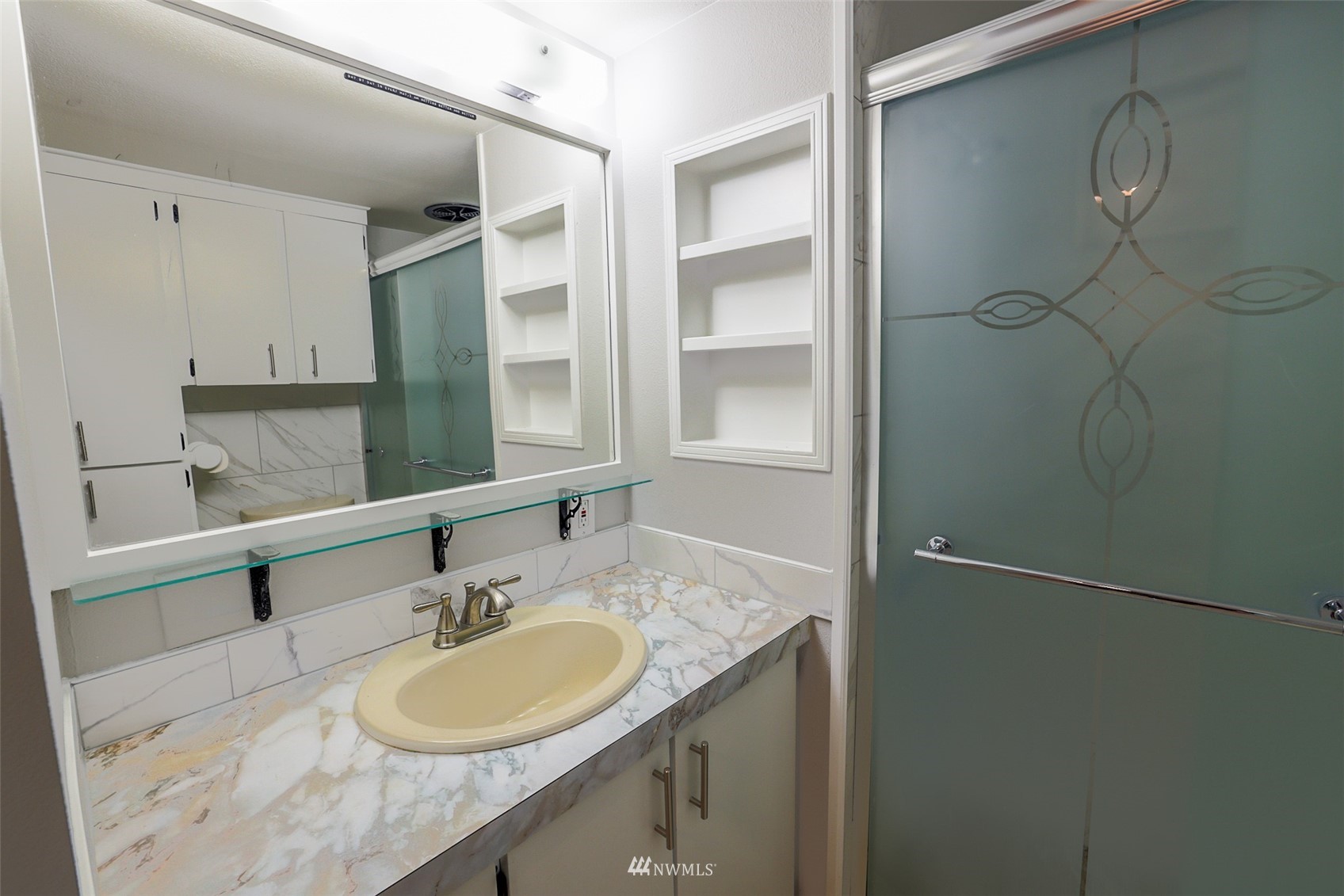 3504 Seattle Hill Road, Unit 2 Mill Creek, WA 98012 - Photo 28 of 30 a bathroom with a granite countertop sink a mirror and a shower
