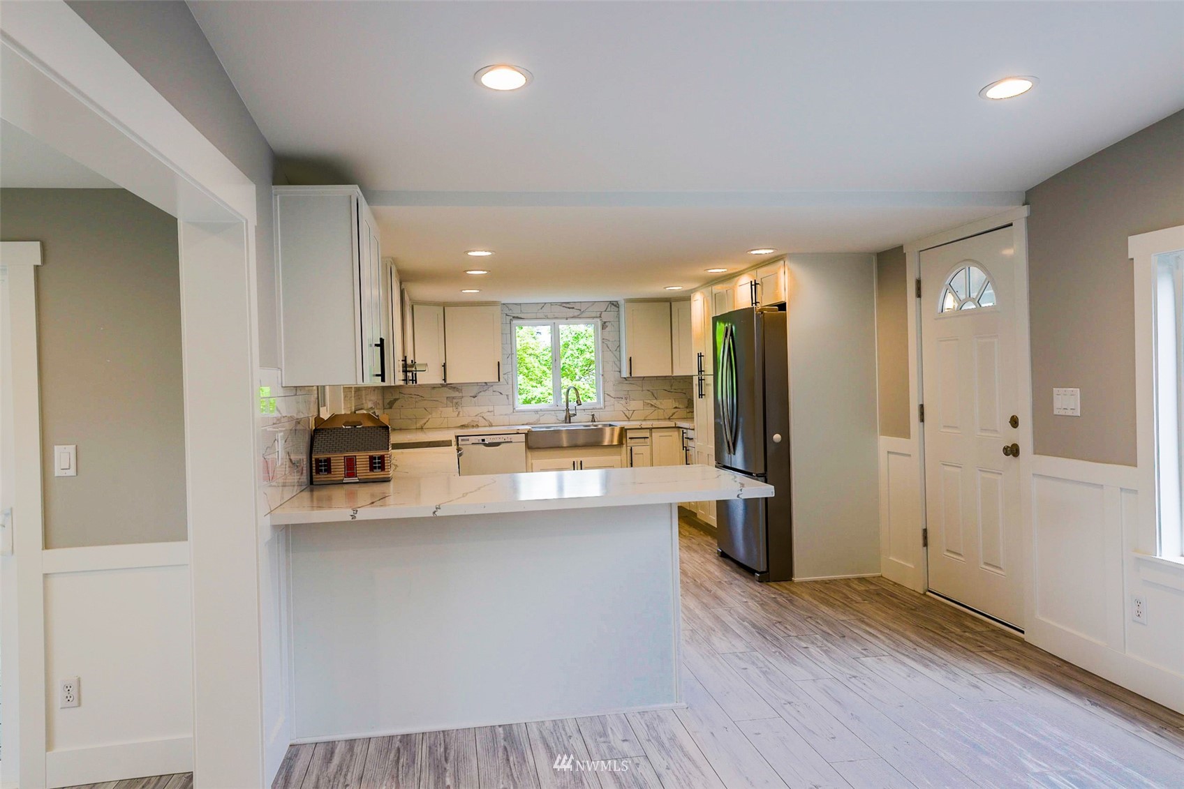 3504 Seattle Hill Road, Unit 2 Mill Creek, WA 98012 - Photo 9 of 30 a kitchen with stainless steel appliances a refrigerator and a stove top oven