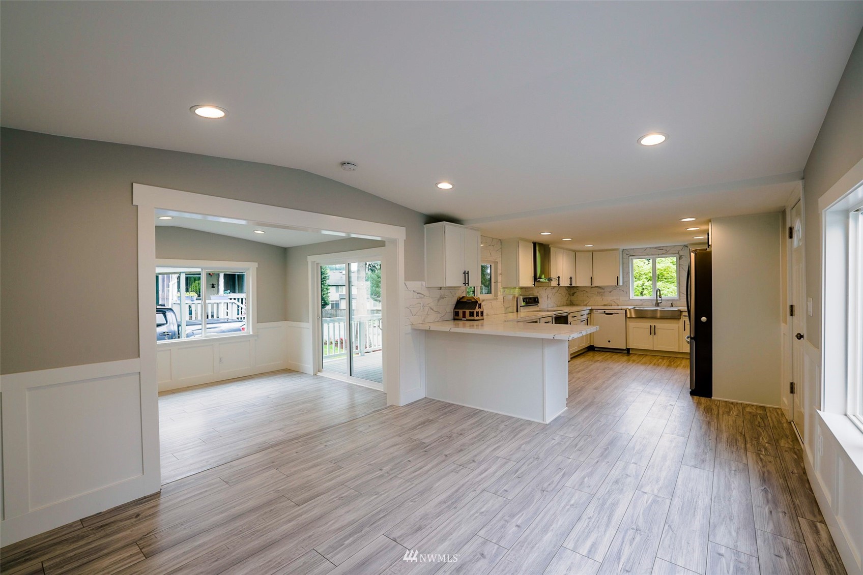 3504 Seattle Hill Road, Unit 2 Mill Creek, WA 98012 - Photo 10 of 30 a view of kitchen and dining room with wooden floor