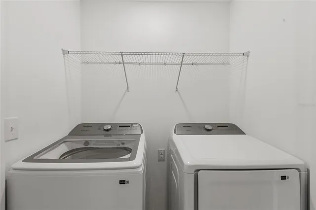a utility room with dryer and washer