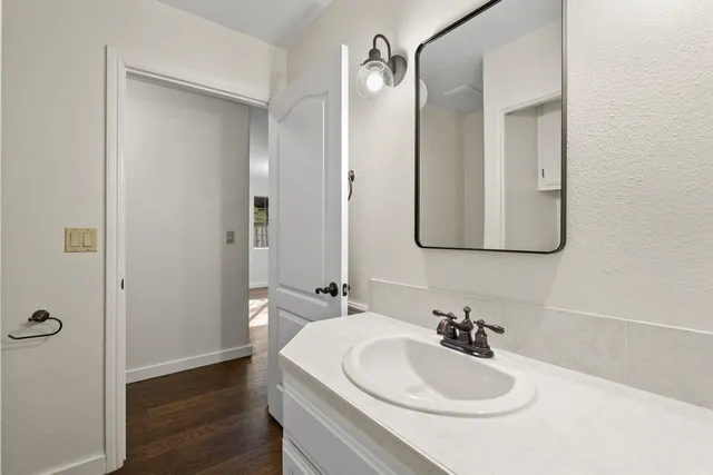 a bathroom with a sink and a mirror