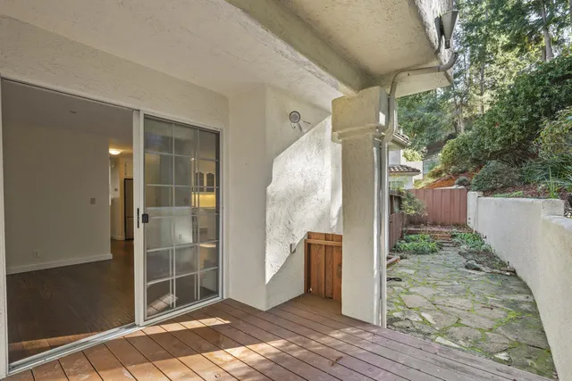 a view of balcony with wooden floor