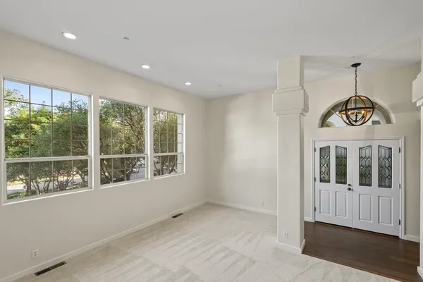 a view of an entryway with wooden floor