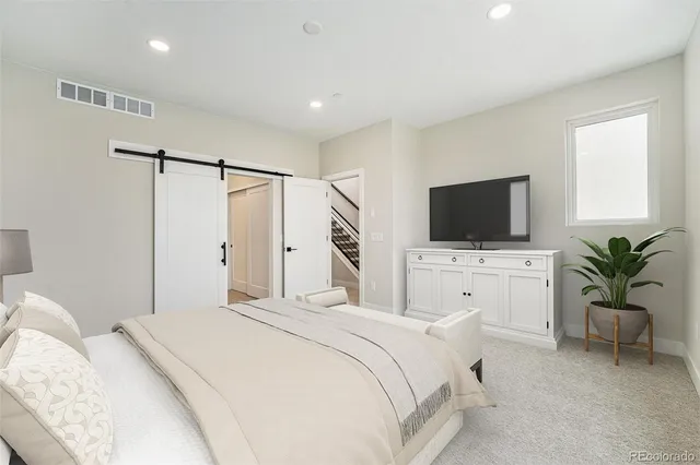 a bathroom with a toilet sink and shower