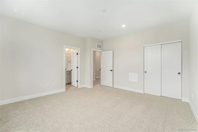 a bathroom with a sink a toilet a mirror and shower