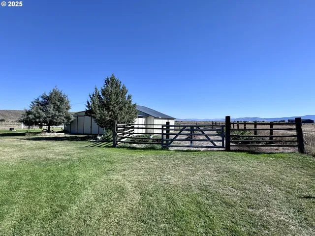 a view of backyard with green space