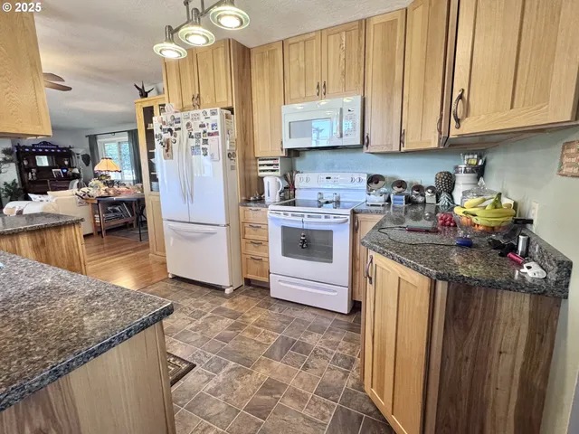 a kitchen with sink and cabinets