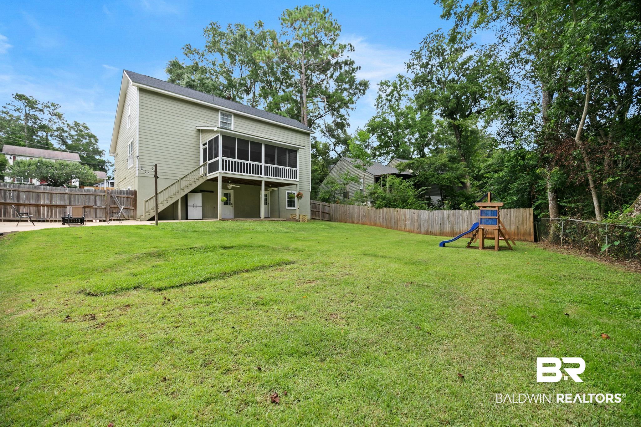 342 Ridgewood Drive Daphne, AL 36526 - Photo 29 of 36 Rear view of house with a playground and a yard