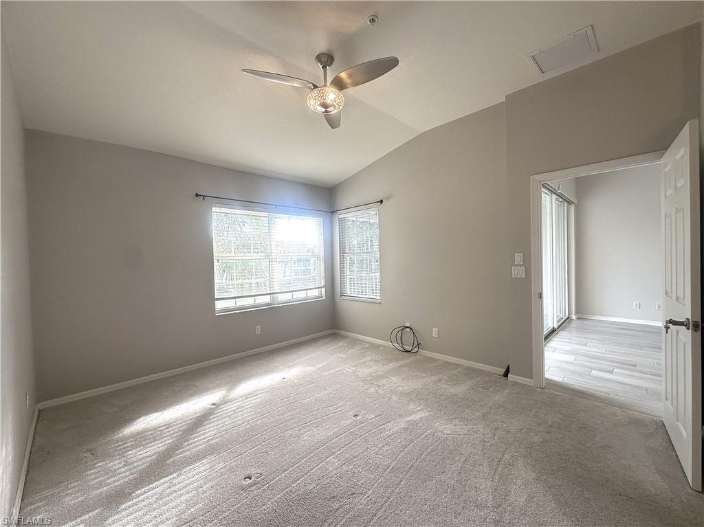 6922 Satinleaf Road North, Unit 203 Naples, FL 34109 - Photo 13 of 31 a view of an empty room with a window