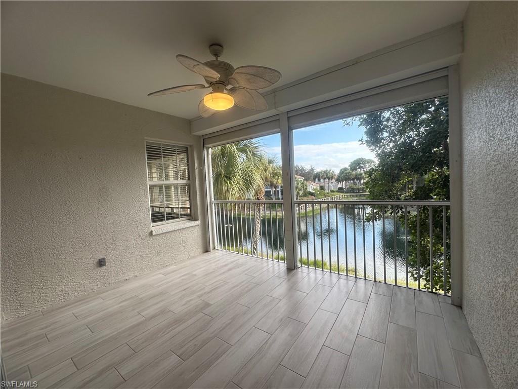 6922 Satinleaf Road North, Unit 203 Naples, FL 34109 - Photo 21 of 31 a view of a room with wooden floor and balcony