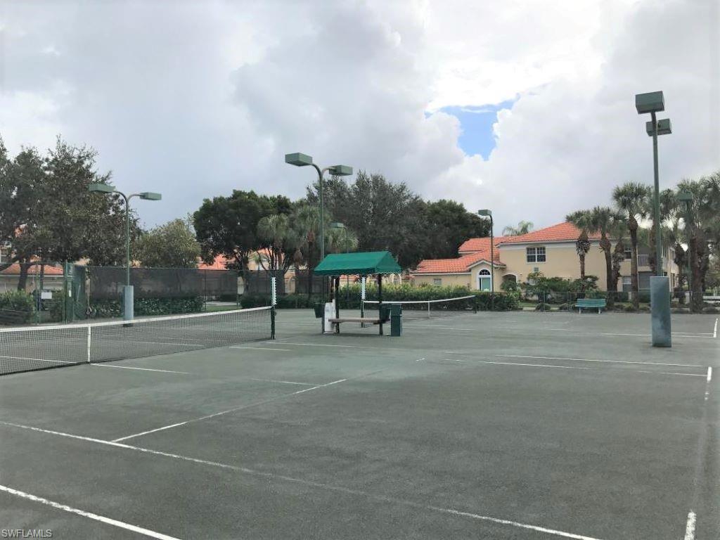 6922 Satinleaf Road North, Unit 203 Naples, FL 34109 - Photo 30 of 31 a view of a basketball court