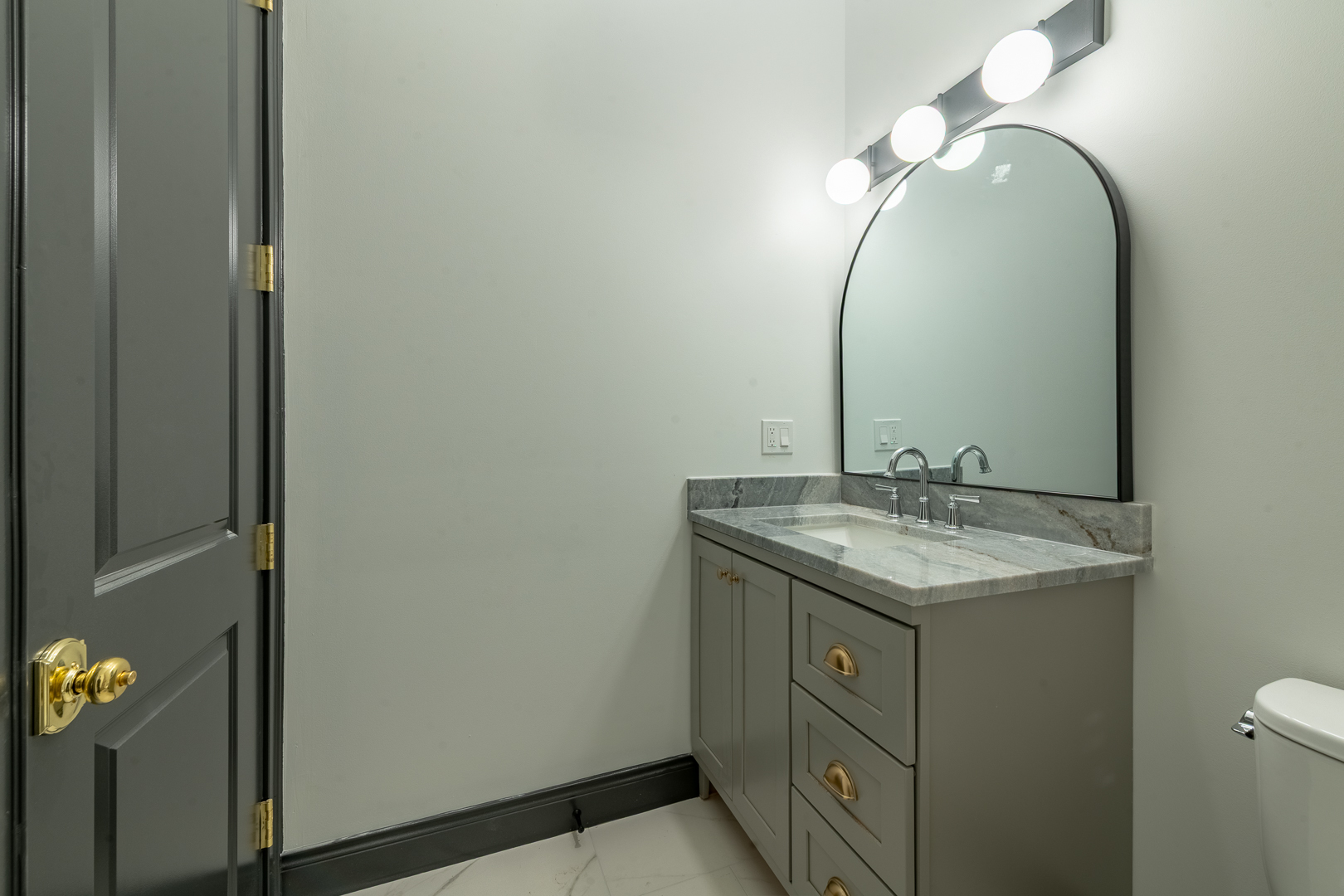 28 North Throop Street, Unit 2 Chicago, IL 60607 - Photo 12 of 35 a bathroom with a granite countertop sink and a mirror