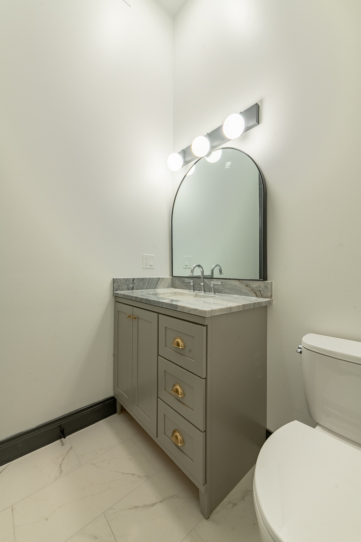 28 North Throop Street, Unit 2 Chicago, IL 60607 - Photo 13 of 35 a bathroom with a toilet sink and mirror