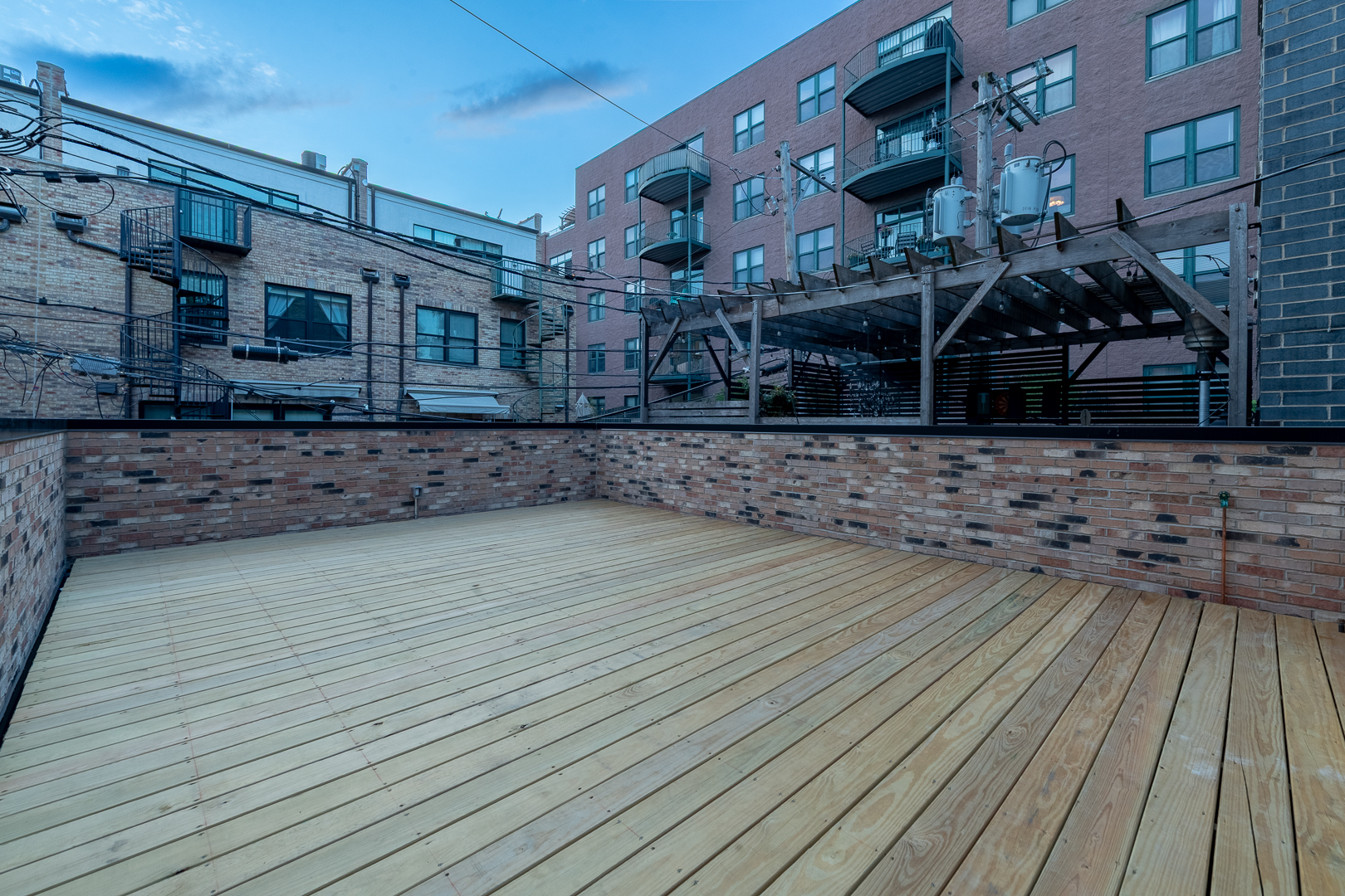 28 North Throop Street, Unit 2 Chicago, IL 60607 - Photo 15 of 35 a view of a house with a wooden deck