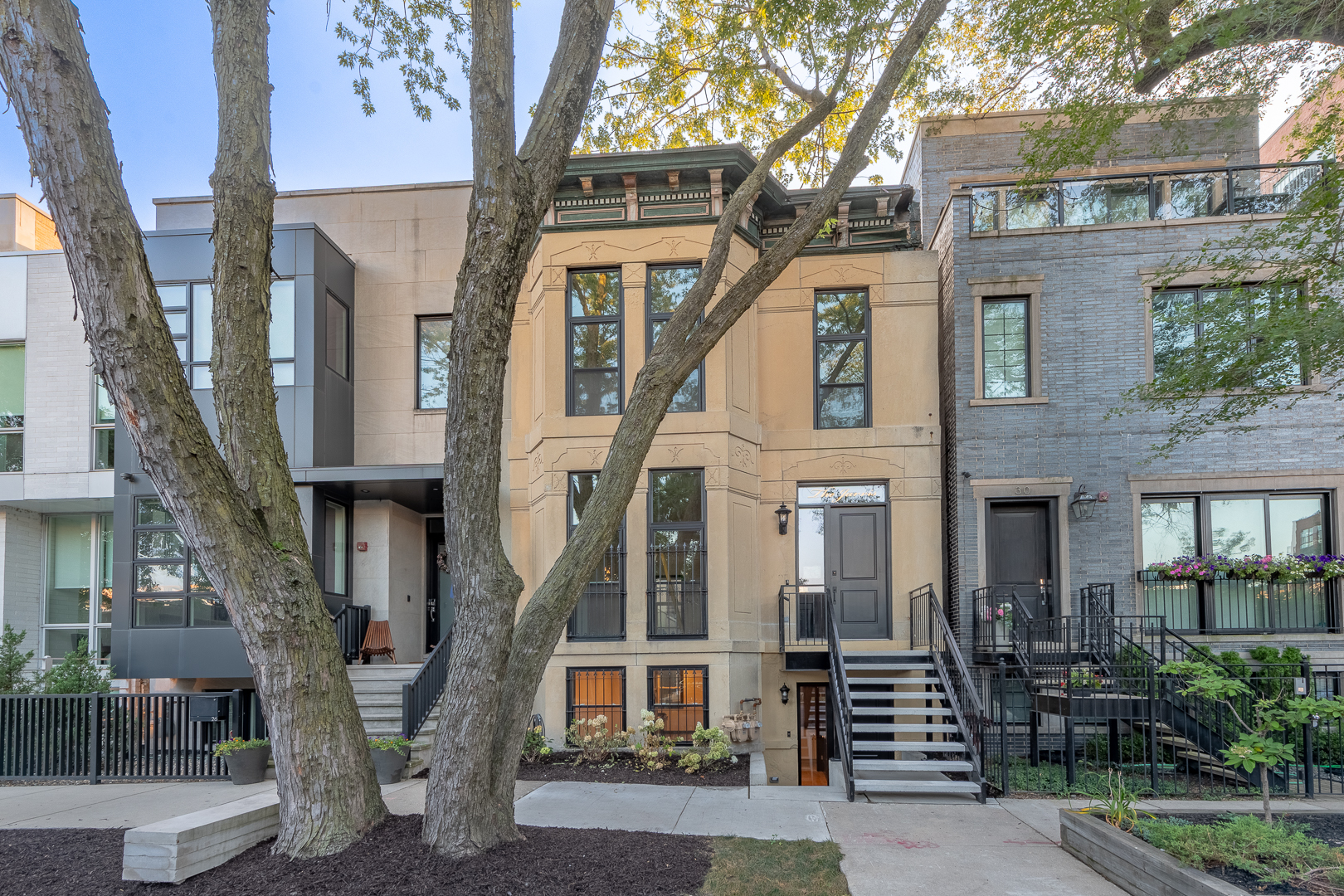 28 North Throop Street, Unit 2 Chicago, IL 60607 - Photo 2 of 35 a front view of a house with a tree